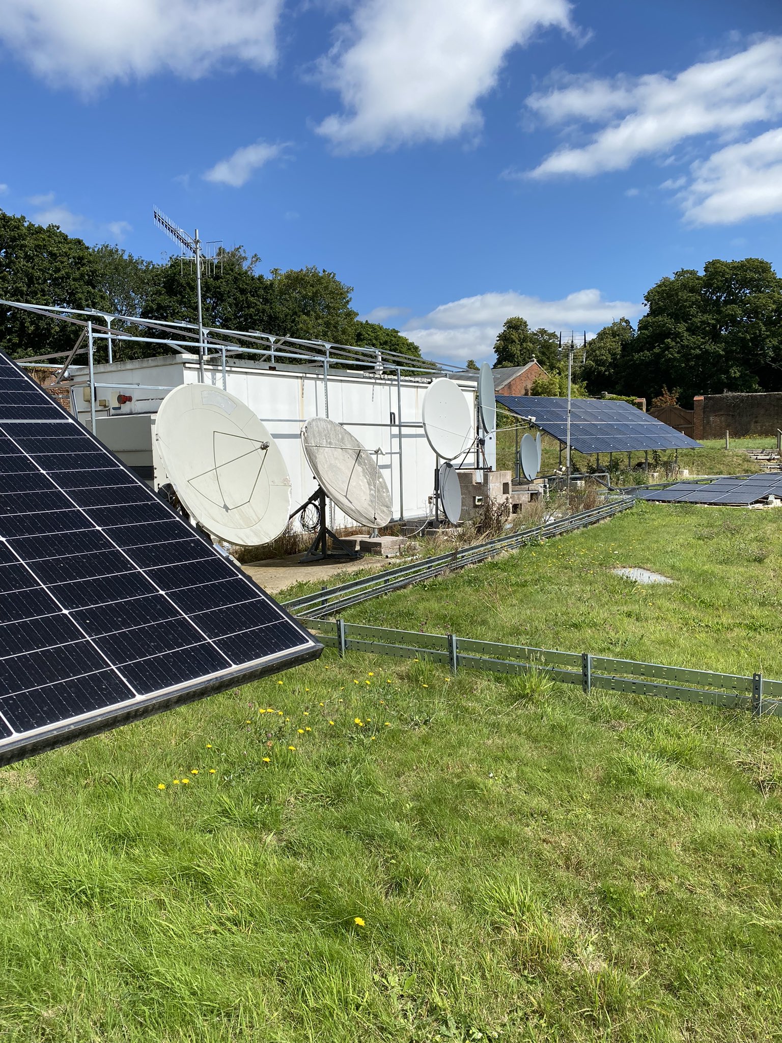 Walled Garden's solar panels and dishes prominently displayed.